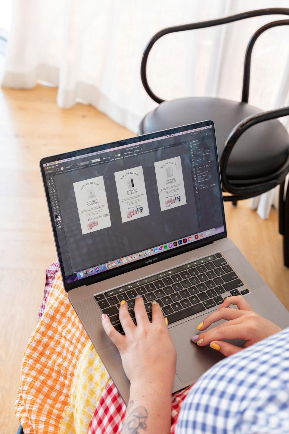 Person designing product mockups on a MacBook Pro.